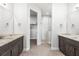 Double vanity bathroom with dark brown cabinets and marble countertops at 15136 Hennipen Cir, Port Charlotte, FL 33981