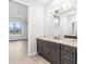 Modern bathroom with dark brown vanity and marble countertop at 15136 Hennipen Cir, Port Charlotte, FL 33981