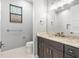 Elegant bathroom with dark vanity and mirror at 15136 Hennipen Cir, Port Charlotte, FL 33981