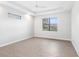 Bright and airy bedroom featuring wood-look floors and ceiling fan at 15136 Hennipen Cir, Port Charlotte, FL 33981