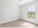Light and airy bedroom with wood-look floors and window at 15136 Hennipen Cir, Port Charlotte, FL 33981