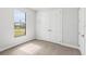 Well-lit bedroom with double doors and window at 15136 Hennipen Cir, Port Charlotte, FL 33981