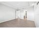 Large bedroom with wood-look floors and access to the bathroom at 15136 Hennipen Cir, Port Charlotte, FL 33981