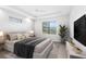 Spacious bedroom with wood-look floors and large window at 15136 Hennipen Cir, Port Charlotte, FL 33981