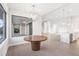 Bright dining area with a round wooden table and a view to the backyard at 15136 Hennipen Cir, Port Charlotte, FL 33981
