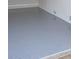 Close-up of a clean, epoxy-coated garage floor with a glossy, speckled finish, offering durability and modern appeal at 15136 Hennipen Cir, Port Charlotte, FL 33981