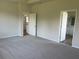Spacious bedroom with plush carpet, neutral walls, and en-suite bathroom access for a peaceful retreat at 16030 10Th E Ave, Bradenton, FL 34212