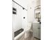 Modern bathroom with white subway tile and hexagon floor tile at 1779 Shore Acres Ne Blvd, St Petersburg, FL 33703