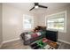 Cozy bedroom with a twin-sized bed, ample natural light, and gray flooring at 1779 Shore Acres Ne Blvd, St Petersburg, FL 33703