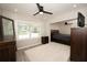 Bedroom with a queen bed, ceiling fan, and lots of natural light at 1779 Shore Acres Ne Blvd, St Petersburg, FL 33703