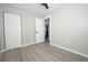 Simple bedroom with gray flooring and a closet at 1779 Shore Acres Ne Blvd, St Petersburg, FL 33703