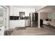 Modern kitchen with stainless steel appliances and granite countertops at 1779 Shore Acres Ne Blvd, St Petersburg, FL 33703