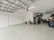 Garage with overhead storage and epoxy floor at 19757 Long Lake Ranch Blvd, Lutz, FL 33558