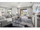 Inviting living room with sliding glass doors to covered patio overlooking the lake at 19757 Long Lake Ranch Blvd, Lutz, FL 33558