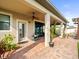 Covered patio with brick pavers, ceiling fan, pillars, and access to backyard at 19757 Long Lake Ranch Blvd, Lutz, FL 33558