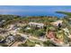 Aerial view showcasing a condo building's waterfront location and surrounding landscape at 206 Tarpon Pt, Tarpon Springs, FL 34689