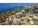 Aerial view of a waterfront condo building and its surroundings, ideal for showcasing location at 206 Tarpon Pt, Tarpon Springs, FL 34689