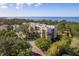 Aerial view of building, pool, and waterfront at 206 Tarpon Pt, Tarpon Springs, FL 34689