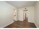 Spacious bedroom with hardwood flooring and access to bathroom at 206 Tarpon Pt, Tarpon Springs, FL 34689
