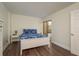 Bedroom with white bed frame and blue bedding at 206 Tarpon Pt, Tarpon Springs, FL 34689