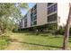 Building exterior showcasing landscaping and lawn at 206 Tarpon Pt, Tarpon Springs, FL 34689