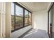 Bright lanai with view of surrounding landscape at 206 Tarpon Pt, Tarpon Springs, FL 34689