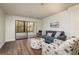 Living room with comfortable seating and access to lanai at 206 Tarpon Pt, Tarpon Springs, FL 34689