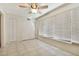 Sunroom with tile floors, window blinds, and ceiling fan at 2341 Haitian Dr # 49, Clearwater, FL 33763