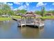 Gazebo on a wooden dock over water at 3398 Pinnacle S Ct, Palm Harbor, FL 34684