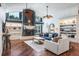 Relaxing living room with fireplace, built-in shelving and hardwood floors at 3398 Pinnacle S Ct, Palm Harbor, FL 34684