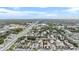 Wide aerial view showing condo community near highway and city skyline at 3806 N Lake Dr # 24, Tampa, FL 33614