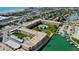 Aerial view of condo complex with pool and waterfront access at 400 64 Ave # 1207, St Pete Beach, FL 33706