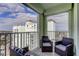 Relaxing balcony with wicker chairs and stunning water views at 400 64 Ave # 1207, St Pete Beach, FL 33706