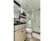 Updated bathroom with a walk-in shower and granite vanity at 400 64 Ave # 1207, St Pete Beach, FL 33706
