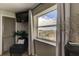 Bedroom with a seating area and large window overlooking the city at 400 64 Ave # 1207, St Pete Beach, FL 33706
