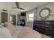 Main bedroom with a king-size bed, plenty of natural light, and a dresser at 400 64 Ave # 1207, St Pete Beach, FL 33706