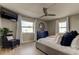 Main bedroom with a king-size bed, plenty of natural light, and a dresser at 400 64 Ave # 1207, St Pete Beach, FL 33706