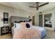 Main bedroom with a king-size bed, plenty of natural light, and a dresser at 400 64 Ave # 1207, St Pete Beach, FL 33706