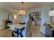 Open concept dining area with kitchen view, perfect for entertaining at 400 64 Ave # 1207, St Pete Beach, FL 33706