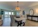 Bright dining room with light-colored table and chairs at 400 64 Ave # 1207, St Pete Beach, FL 33706