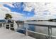 Wooden dock offering scenic water views and access to the waterway at 400 64 Ave # 1207, St Pete Beach, FL 33706
