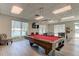 Relaxing game room with pool table, air hockey, and seating at 400 64 Ave # 1207, St Pete Beach, FL 33706