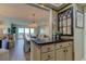Kitchen with granite countertop and view to living room at 400 64 Ave # 1207, St Pete Beach, FL 33706