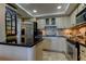 Modern kitchen with stainless steel appliances and granite countertops at 400 64 Ave # 1207, St Pete Beach, FL 33706