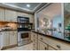 Eat-in kitchen with stainless steel appliances and granite counters at 400 64 Ave # 1207, St Pete Beach, FL 33706