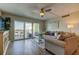 Spacious living room featuring comfortable seating and stunning water views at 400 64 Ave # 1207, St Pete Beach, FL 33706