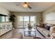 Relaxing living room with balcony access and water views at 400 64 Ave # 1207, St Pete Beach, FL 33706