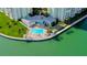 Relaxing waterfront pool area with lounge chairs at 400 64 Ave # 1207, St Pete Beach, FL 33706