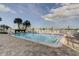 Relaxing community pool area with surrounding patio at 400 64 Ave # 1207, St Pete Beach, FL 33706