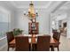 Bright dining room featuring a chandelier and display cabinet at 5210 Covesound Way, Apollo Beach, FL 33572